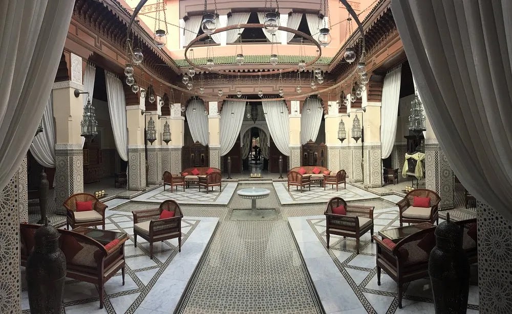 Traditional Moroccan riad courtyard in Marrakech showcasing elegant architecture and authentic décor