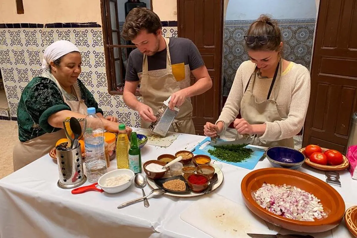 Hands-on Moroccan cooking class preparing a tagine dish in Marrakech